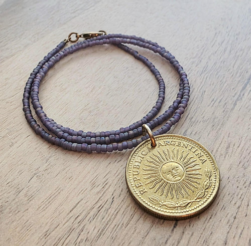 1978 Argentina Gold Sun Coin Necklace, Matte Purple Glass Seed Bead Chain, Solid Brass Clasp, Gift Boxed, Made in USA by E. Ria Designs