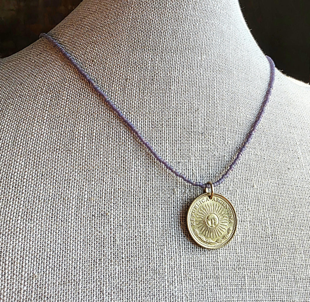 1978 Argentina Gold Sun Coin Necklace, Matte Purple Glass Seed Bead Chain, Solid Brass Clasp, Gift Boxed, Made in USA by E. Ria Designs