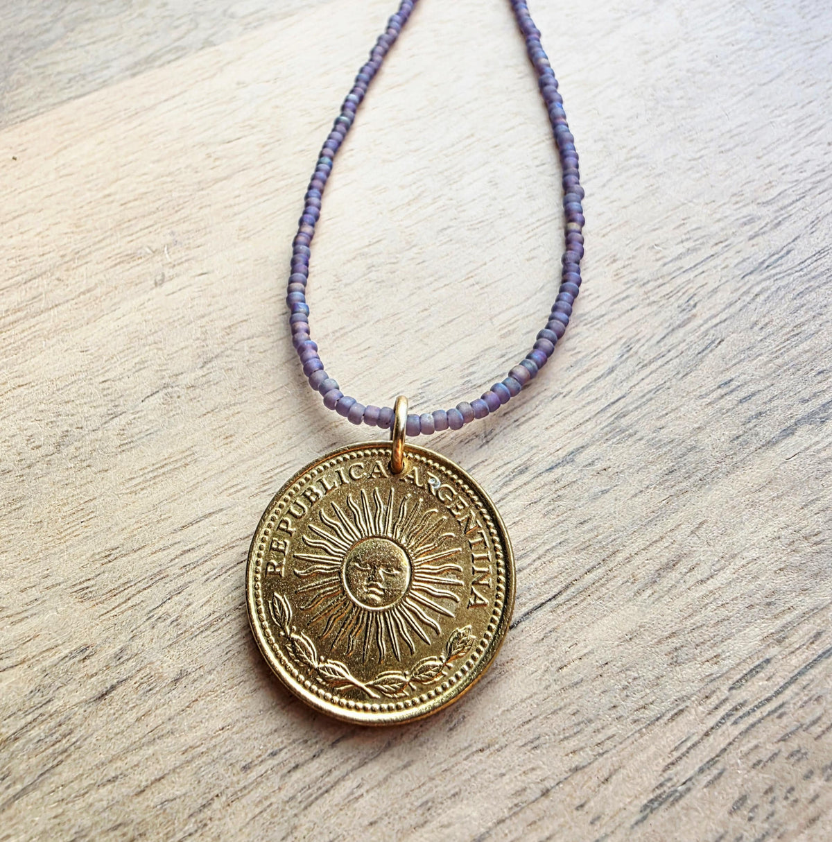1978 Argentina Gold Sun Coin Necklace, Matte Purple Glass Seed Bead Chain, Solid Brass Clasp, Gift Boxed, Made in USA by E. Ria Designs
